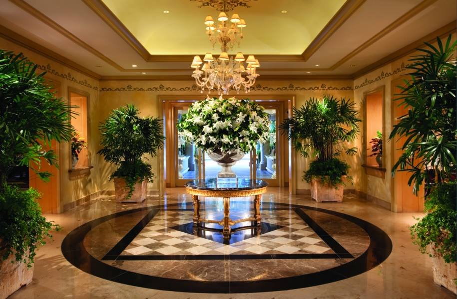 upscale lobby with silk plant trees and silk floral centerpiece